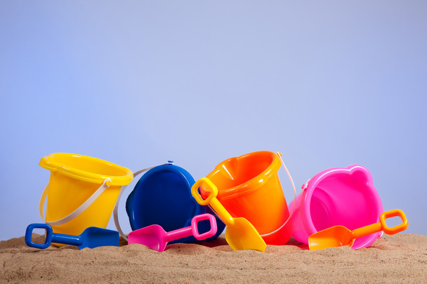 Row of colorful beach buckets or pails - Foto, imagen