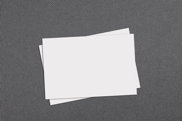 Top view of blank business card on grey paper background - Photo, Image