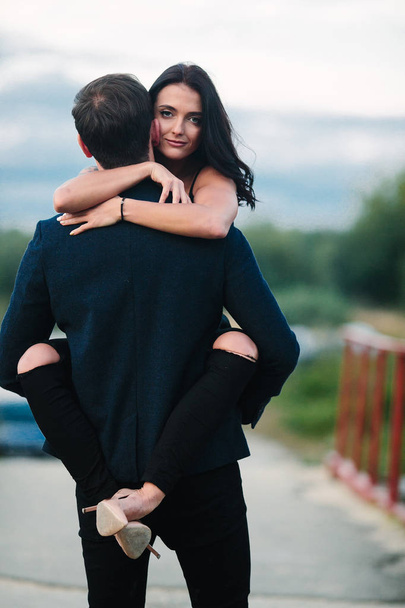 man holding his girlfriend on hands - Фото, зображення