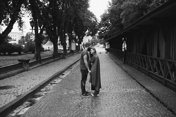 couple posing on a city street - Фото, изображение
