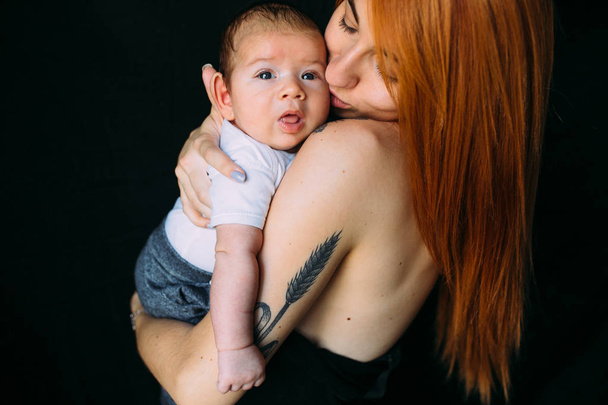Young mother woman holding her child baby - Photo, image