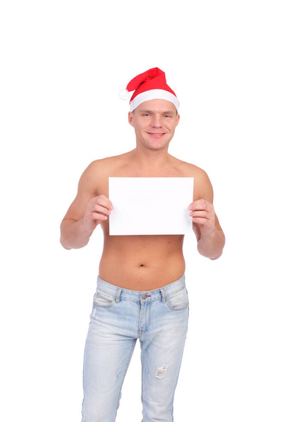 handsome young Christmas guy with the blank sheet of paper - 写真・画像