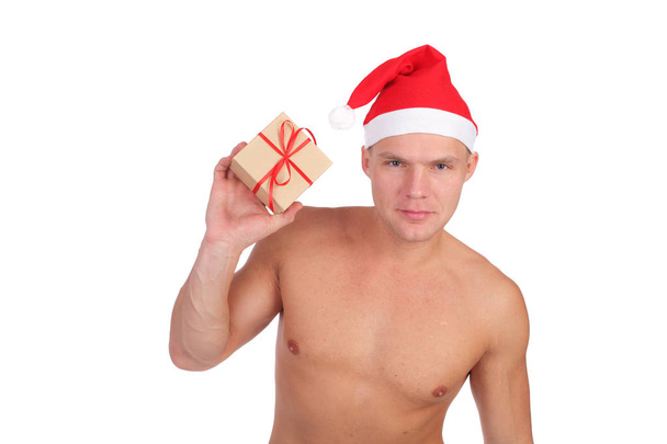 handsome young guy wearing Santa Claus cap - Photo, image