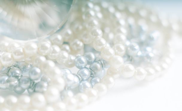 Abstract blurred background, pearl necklace on white. - Photo, Image