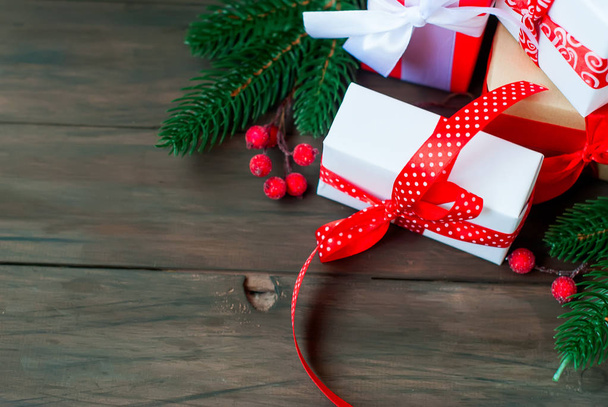 Gift box tied with a red ribbon , fir branches,candy  - Fotoğraf, Görsel