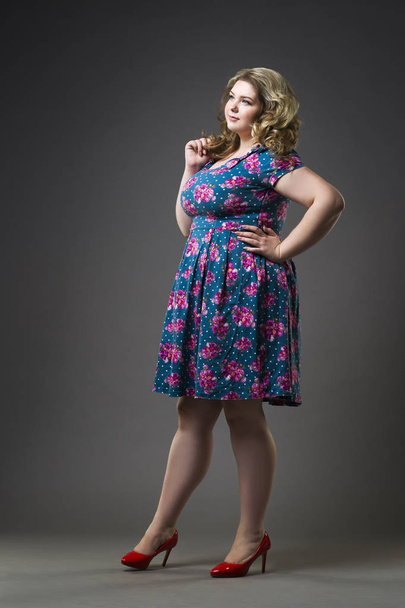 Young beautiful blonde plus size model in dress and shoes, xxl woman on gray studio background - Fotografie, Obrázek