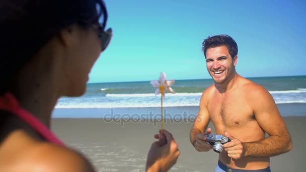  couple taking a photo on the beach - Footage, Video