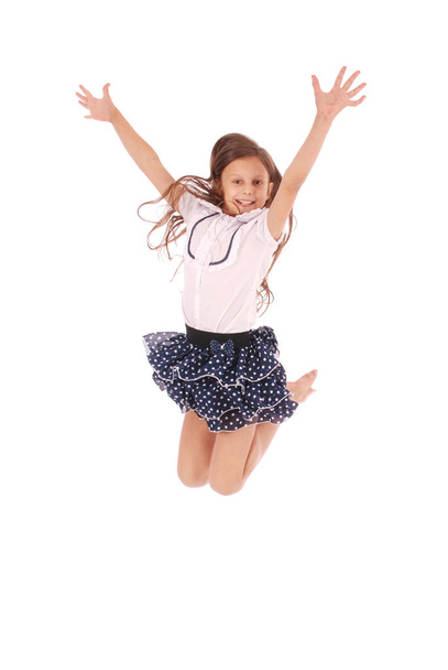 Ccheerful young girl jumping - 写真・画像
