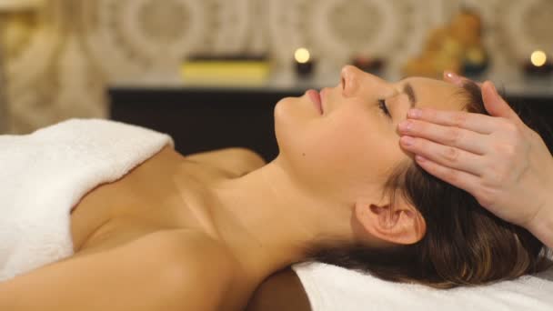 the woman doing the facial massage - Felvétel, videó