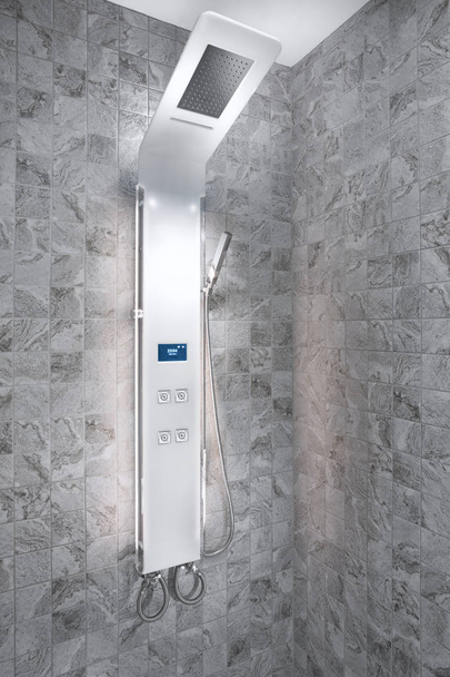close up view of smart electronic shower panel in tiled room - Fotó, kép