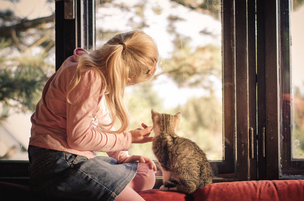 blond girl with little cat - Photo, Image