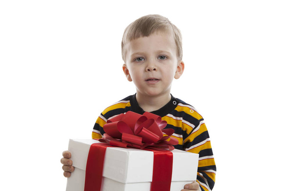 portrait of a little boy with a gift box - Фото, изображение