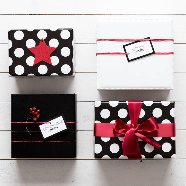 Many elegant and beautifully wrapped black, red and white christmas presents - Foto, Imagem