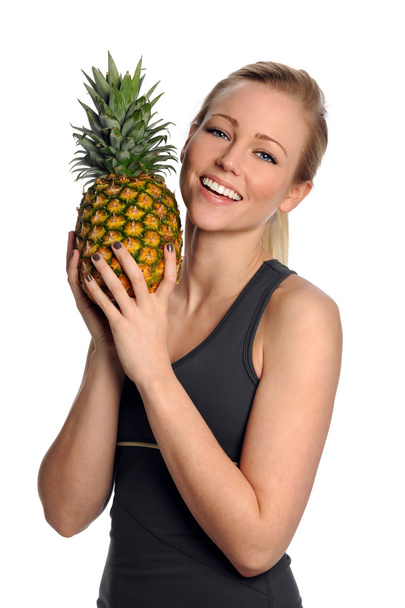 Young Woman Holding Pineapple - Foto, immagini
