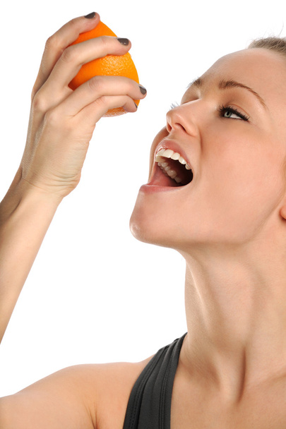 Woman Eating Orange - Фото, изображение