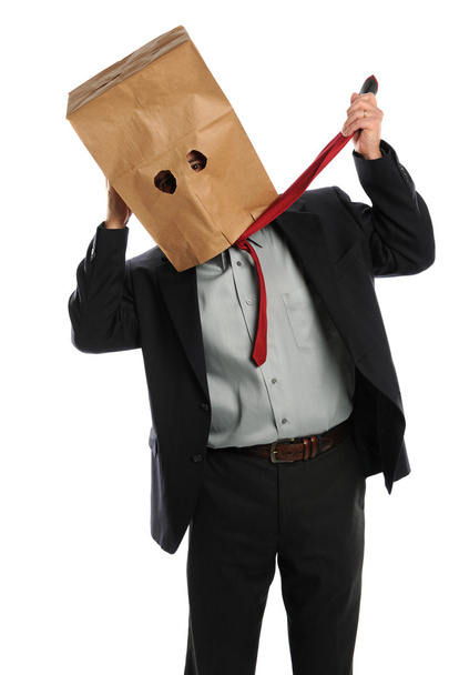 Businessman With Paper Bag on Head Pulling Ties - Foto, imagen