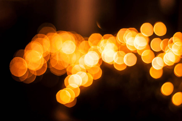 orange Bokeh light of the colorful LED lamp in the night - Фото, изображение