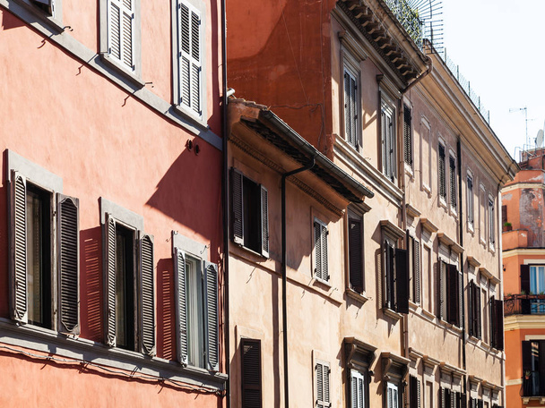 facades of old house on street in Rome city - Fotó, kép
