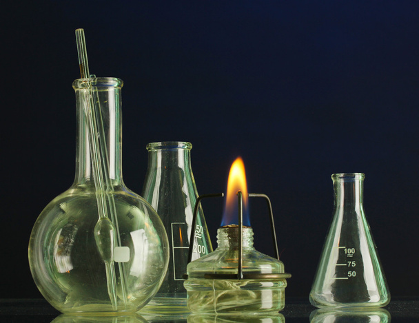 spiritlamp and test-tubes on blue background - Фото, зображення