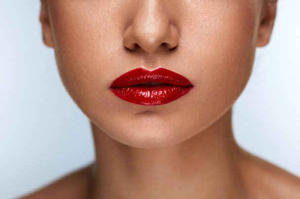 Closeup Beautiful Woman Lips With Red Lipstick On. Beauty Makeup - 写真・画像