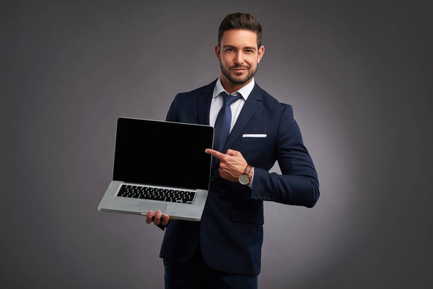 Elegant young man with laptop - Фото, изображение