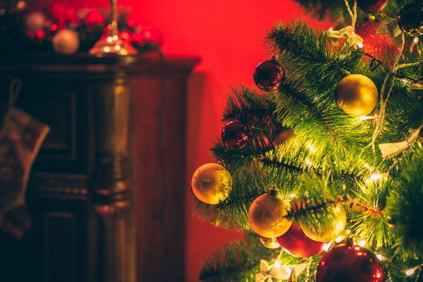 Christmas tree with red and goldish baubles - Φωτογραφία, εικόνα
