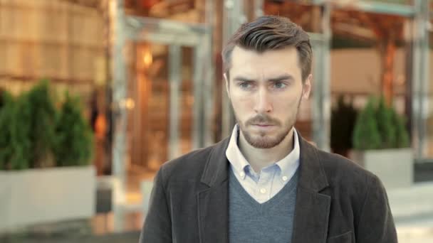 Attractive man is upset and stressed about events in his life - Imágenes, Vídeo