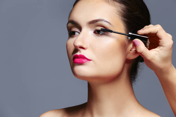 girl applying cosmetics - Photo, image