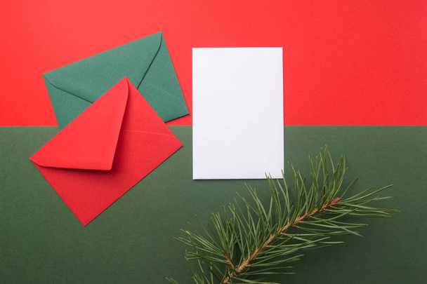 Red and green envelopes on christmas holiday background. Flat lay. - Fotografie, Obrázek