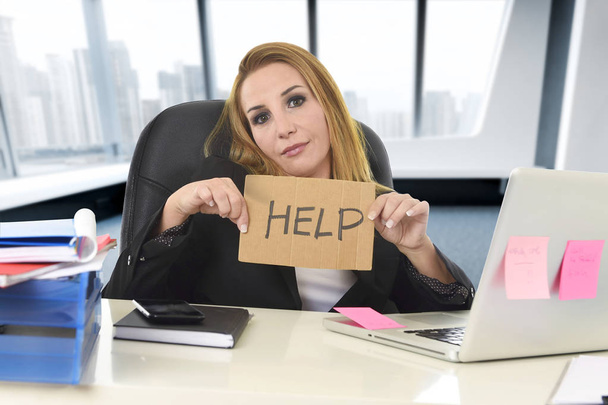 businesswoman in her 40s holding help sign desparate suffering stress overworked - Photo, Image