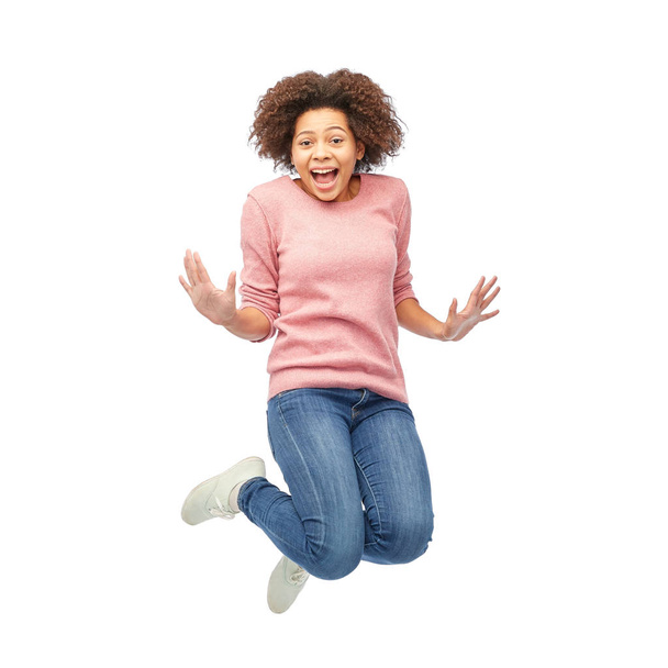 happy african american woman jumping over white - Фото, зображення