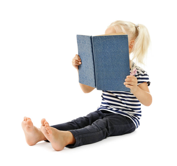 Cute small girl reading book - Foto, immagini