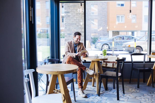 Man Sitting in Coffee Shop  - Photo, image