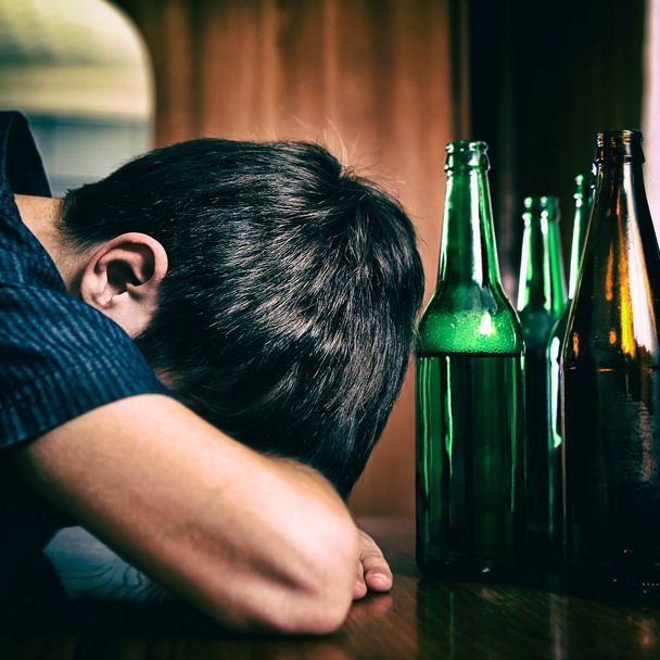 Young Man sleep with the Beer - Фото, зображення