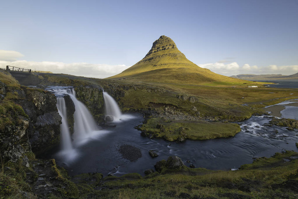 Kirkjufellsfoss waterfall with Kirkjufell mountain Iceland - Фото, зображення