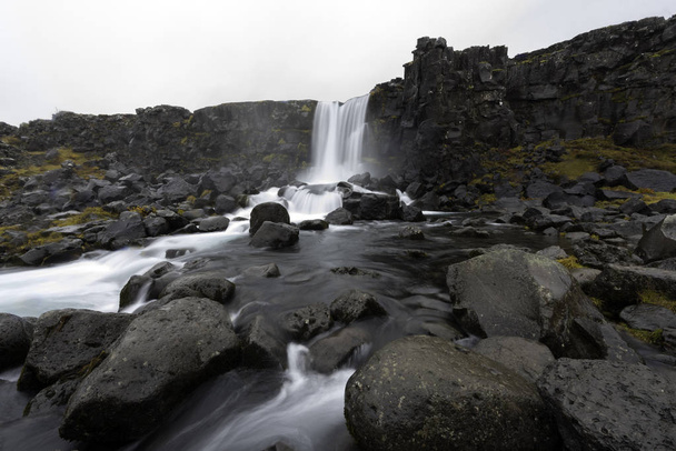 Beautiful Oxararfoss waterfall in Thingvellir national park, western Iceland - Photo, Image