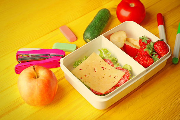 Lunch box with food and stationery - 写真・画像