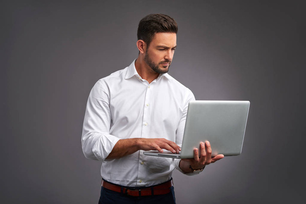 Young man with laptop   - Фото, зображення