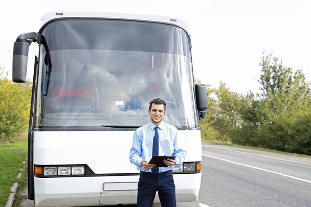 Driver in front of bus - Foto, imagen