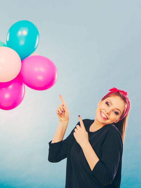 Smiling crazy girl having fun with balloons. - Фото, зображення