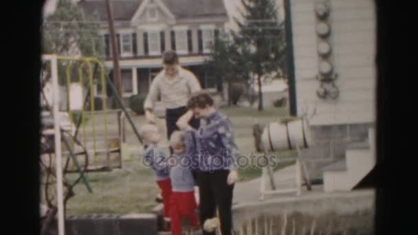 Family walking in backyard - Felvétel, videó