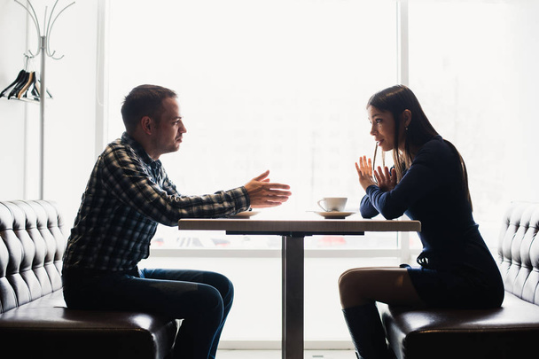 Scene in cafe - couple conflict arguing during the lunch. - 写真・画像