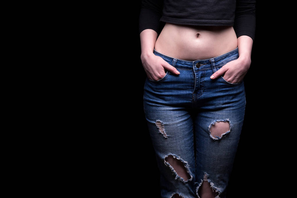 Ripped jeans and womans belly - Foto, immagini