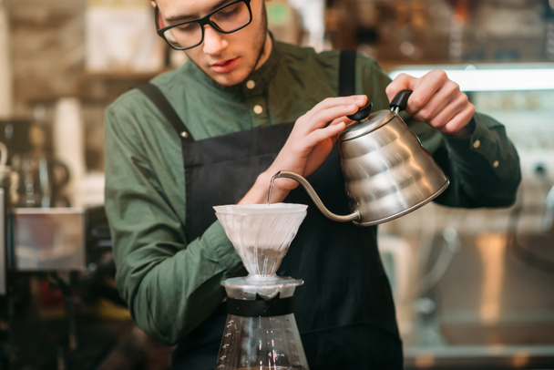 Barman pours coffee in a glass - Photo, Image