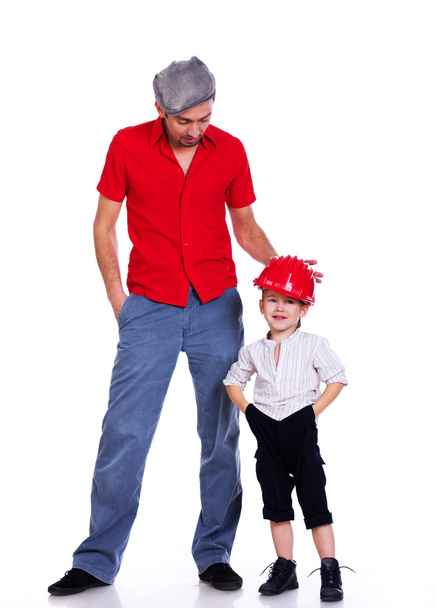 Portrait of family posing on white background in red helmet - Photo, image