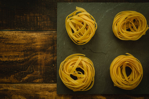 dry pasta on marble slate - Photo, Image