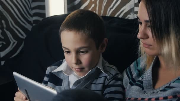 Happy family - mother and kid using tablet pc. Slow motion - Záběry, video