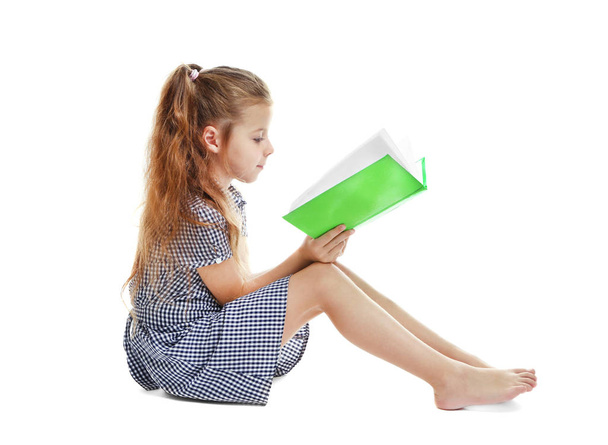 Cute girl reading book  - Fotó, kép