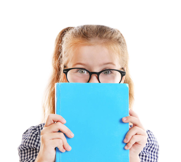 Cute girl with book on white background - Foto, imagen