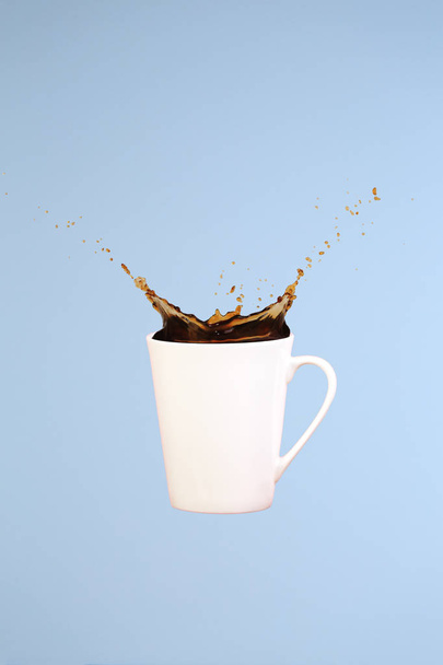 Coffee concept. Minimal art. Solid background. Coffee splashes.  - Photo, Image